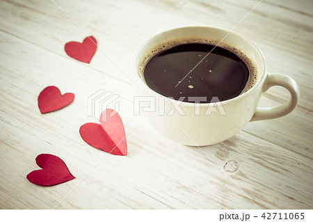 Heart and coffee on a wooden background Heart and coffee on a wooden background 42711065