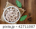 Minced meat on wooden table 42711087