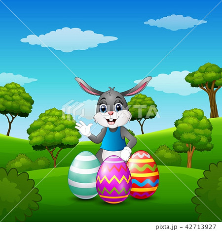 Bunny waving hand with easter eggs in the park Bunny waving hand with easter eggs in the park 42713927