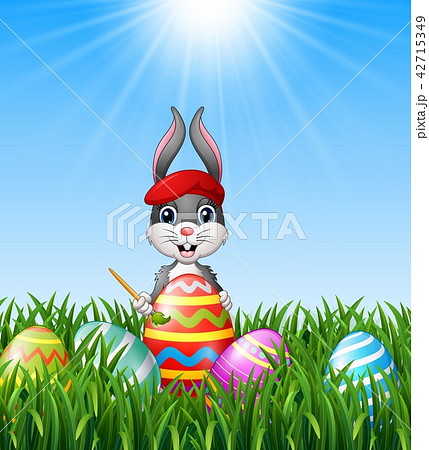 Easter bunny painting easter eggs 42715349