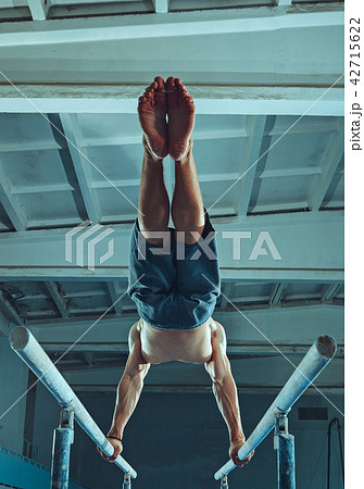 The sportsman during difficult exercise, sports gymnastics 42715622