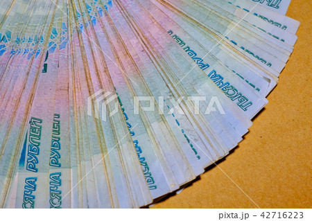 Many thousand notes. Russian rubles. Fan of money on craft paper 42716223