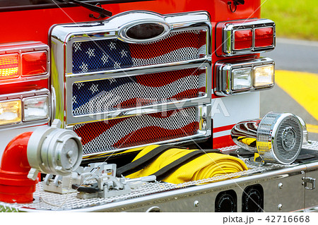 Front of the fire truck at the fire station. 42716668