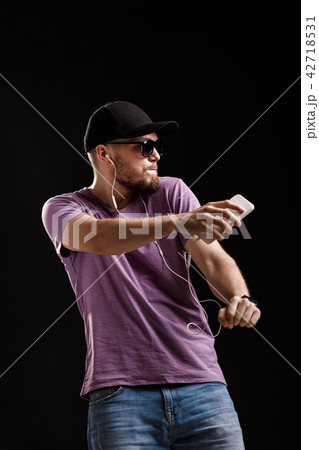 man listening to music in headphones man listening to music in headphones 42718531