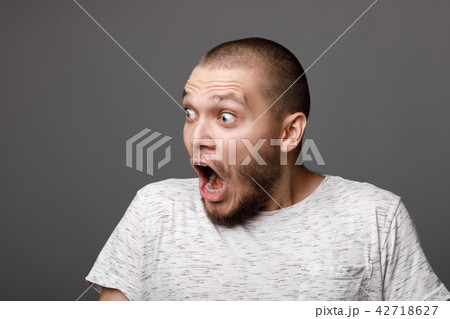 portrait of surprised young man portrait of surprised young man 42718627