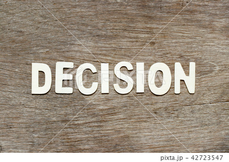 Alphabet letter in decision on wood background Alphabet letter in decision on wood background 42723547