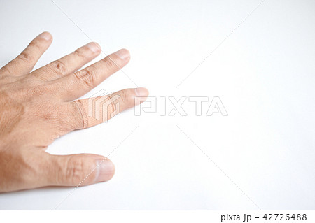 左手人差し指に貼った大型の絆創膏の写真素材