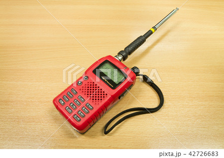 VHF FM transceiver on wooden table background 42726683