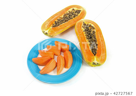 papaya fruit in blue disc with white background 42727567