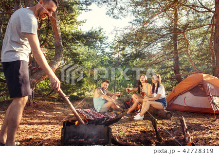 Party, camping of men and women group at forest. They relaxing 42728319