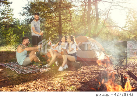 Party, camping of men and women group at forest. They relaxing 42728342