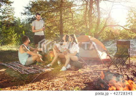 Party, camping of men and women group at forest. They relaxing 42728345