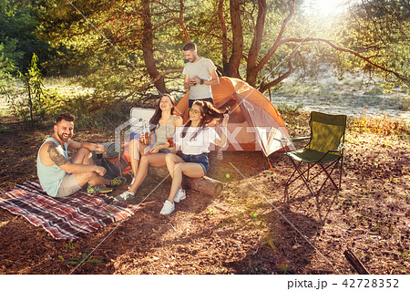 Party, camping of men and women group at forest. They relaxing 42728352