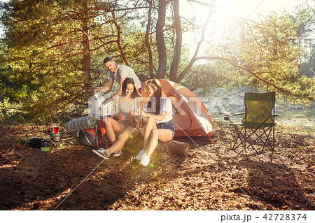 Party, camping of men and women group at forest. They relaxing 42728374