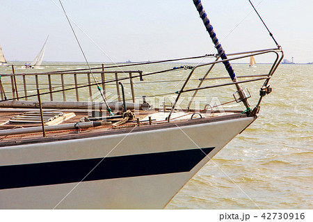 SSailboat bow taken against of sea wave. 42730916