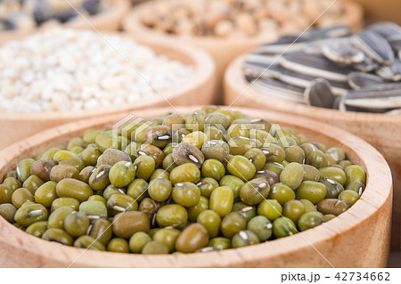 Cereal grains , seeds, beans on wooden background 42734662