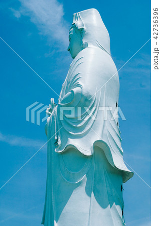 Bodhisattva statue in sky background Bodhisattva statue in sky background 42736396