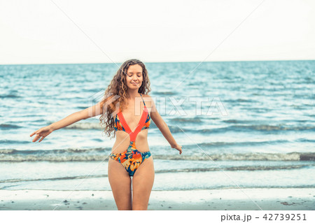 Happy young woman at beach in summer vacation. 42739251