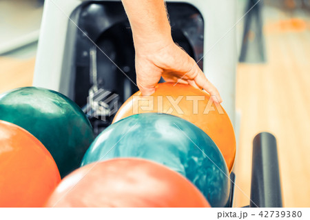 Young man playing bowling. Young man playing bowling. 42739380