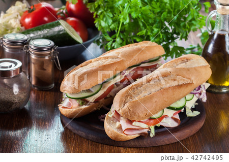 Submarine sandwiches with ham and cheese 42742495