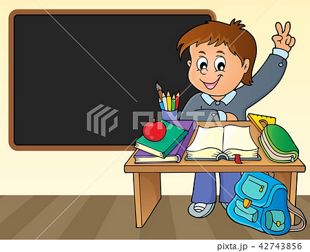 Boy behind school desk theme image 2 42743856