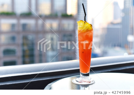 Cocktail glasses on table in rooftop bar city view 42745996