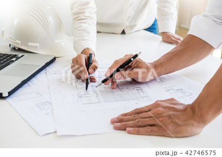 Close-up Of Person's engineer Hand Drawing Plan On Blue Print wi 42746575