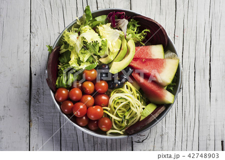 buddha bowl on a white wooden table 42748903