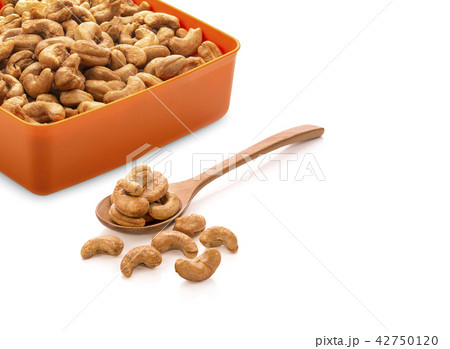 Cashew nuts in a Wooden spoon on white background 42750120