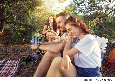 Party, camping of men and women group at forest. They relaxing Party, camping of men and women group at forest. They relaxing 42750765