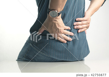 A man suffering from backache, spinal injury 42750877