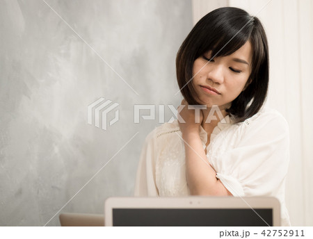unhealthy female in white top with pain in neck unhealthy female in white top with pain in neck 42752911