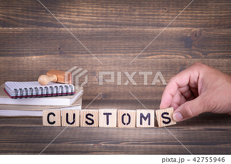 customs. wooden letters on the office desk customs. wooden letters on the office desk 42755946