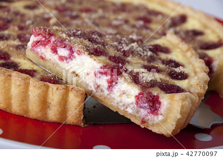 Sand cake with curd filling and raspberries 42770097