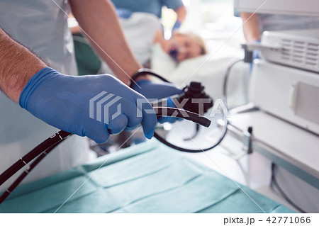 Internist doctors during stomach examination  42771066