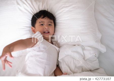 3 years old little cute Asian boy on the bed 3 years old little cute Asian boy on the bed 42773107