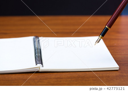 Close up of fountain pen with notebook paper 42773121