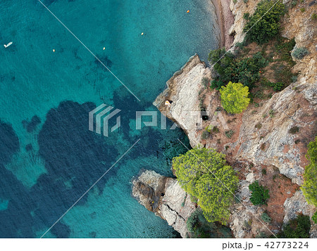 Aerial view of bright turqoise water and beach Aerial view of bright turqoise water and beach 42773224