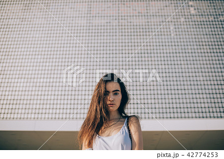 Beautiful girl with long hair and blue eyes Beautiful girl with long hair and blue eyes 42774253