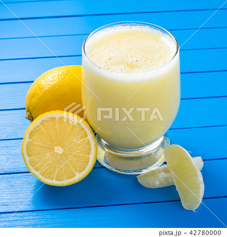 Lemon juice on blue wooden table Lemon juice on blue wooden table 42780000