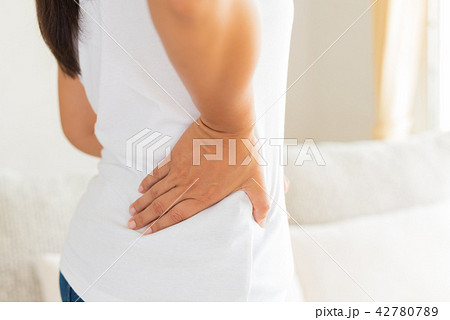 Close up woman having pain in injured back. Close up woman having pain in injured back. 42780789