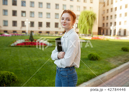 Beautiful red haired girl with freckles  42784446