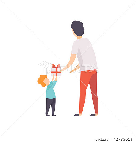 Father giving gift box decorated with red ribbon bow to his little son, people celebrating holiday Father giving gift box decorated with red ribbon bow to his little son, people celebrating holiday 42785013