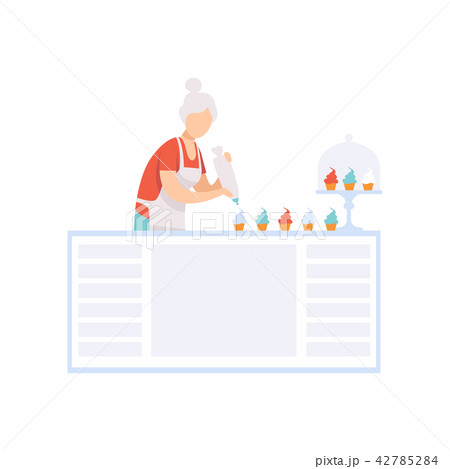 Senior woman character baking cupcakes in the kitchen, elderly people leading an active lifestyle Senior woman character baking cupcakes in the kitchen, elderly people leading an active lifestyle 42785284