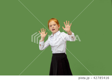 Portrait of the scared teen girl on green Portrait of the scared teen girl on green 42785416