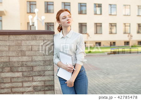 Beautiful red haired girl with freckles 42785478