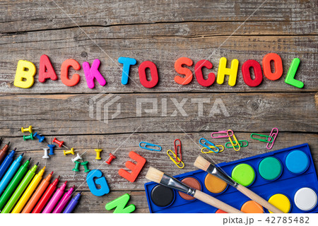 School supplies or accessories on an old table 42785482