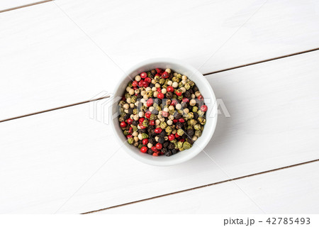 Colorful pepper in white bowl. Close up 42785493