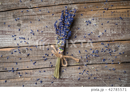 Bunch of lavender flowers on an old wooden table Bunch of lavender flowers on an old wooden table 42785571