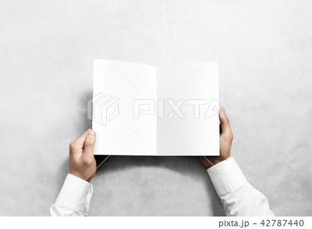 Hand opening blank white brochure booklet mockup. 42787440